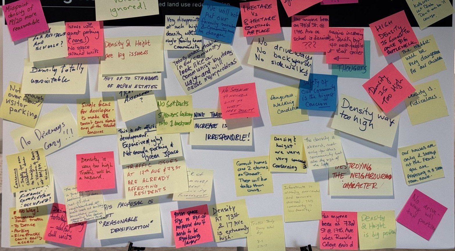 The developer's Share Your Thoughts board at the June 16 open house, covered in resident sticky notes
